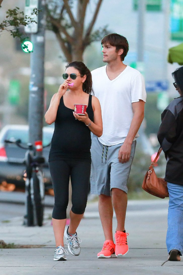 Mila Kunis (5'4") and Ashton Kutcher (6'2")