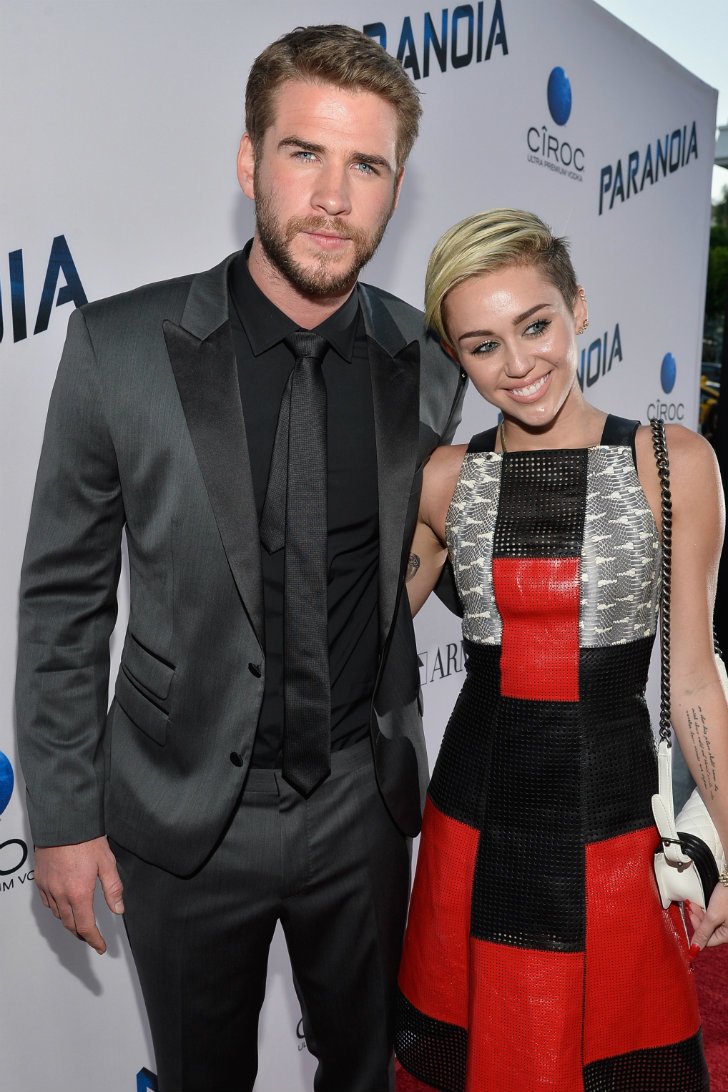 Miley Cyrus (5'5") and Liam Hemsworth (6'3")
