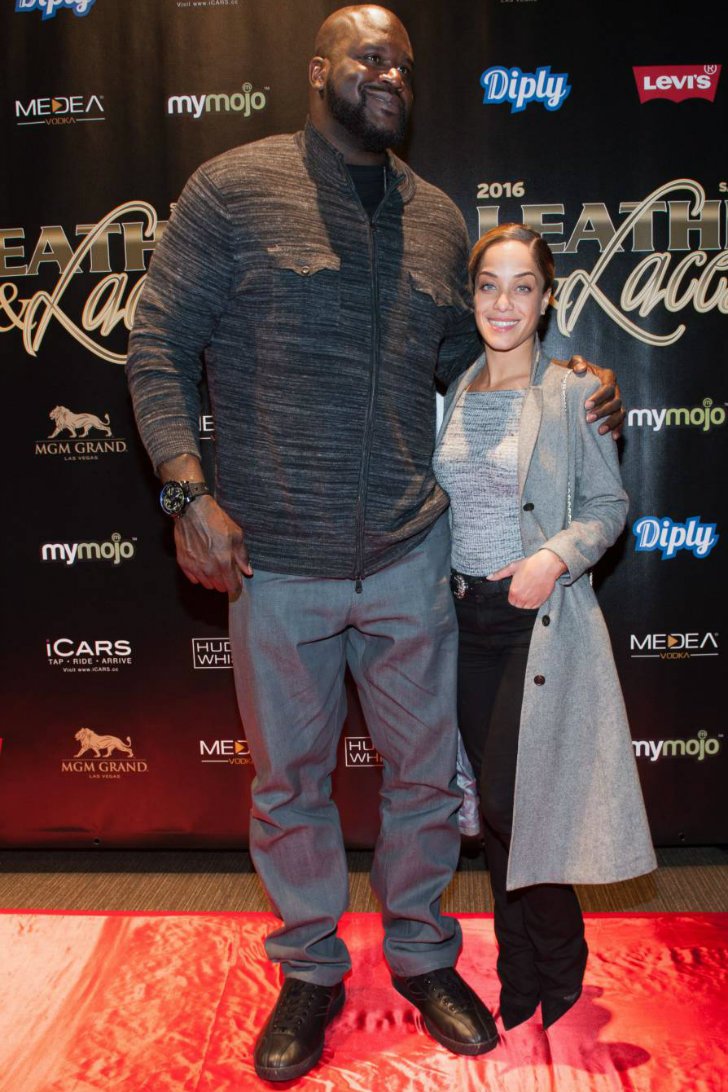 Shaquille O'Neal (7'1") and Laticia Rolle (5'6")